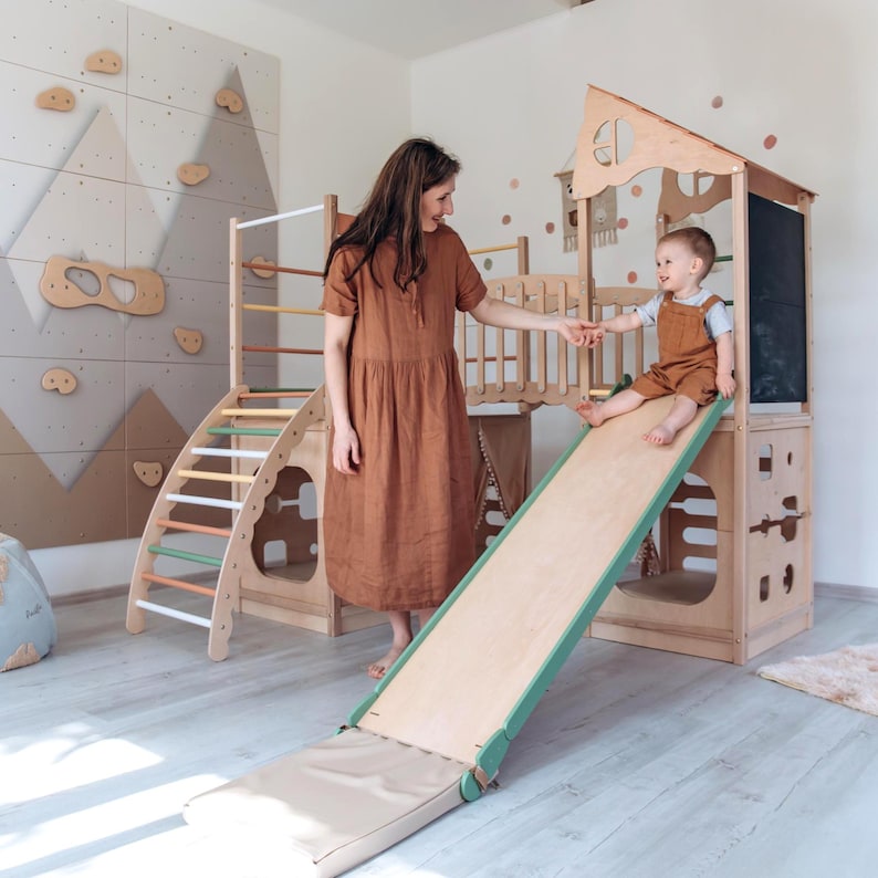 Wooden playhouse feature image for climbing, hiding and imaginative play.